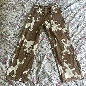 Brown cow print pants. Flare at the bottom. Size L.